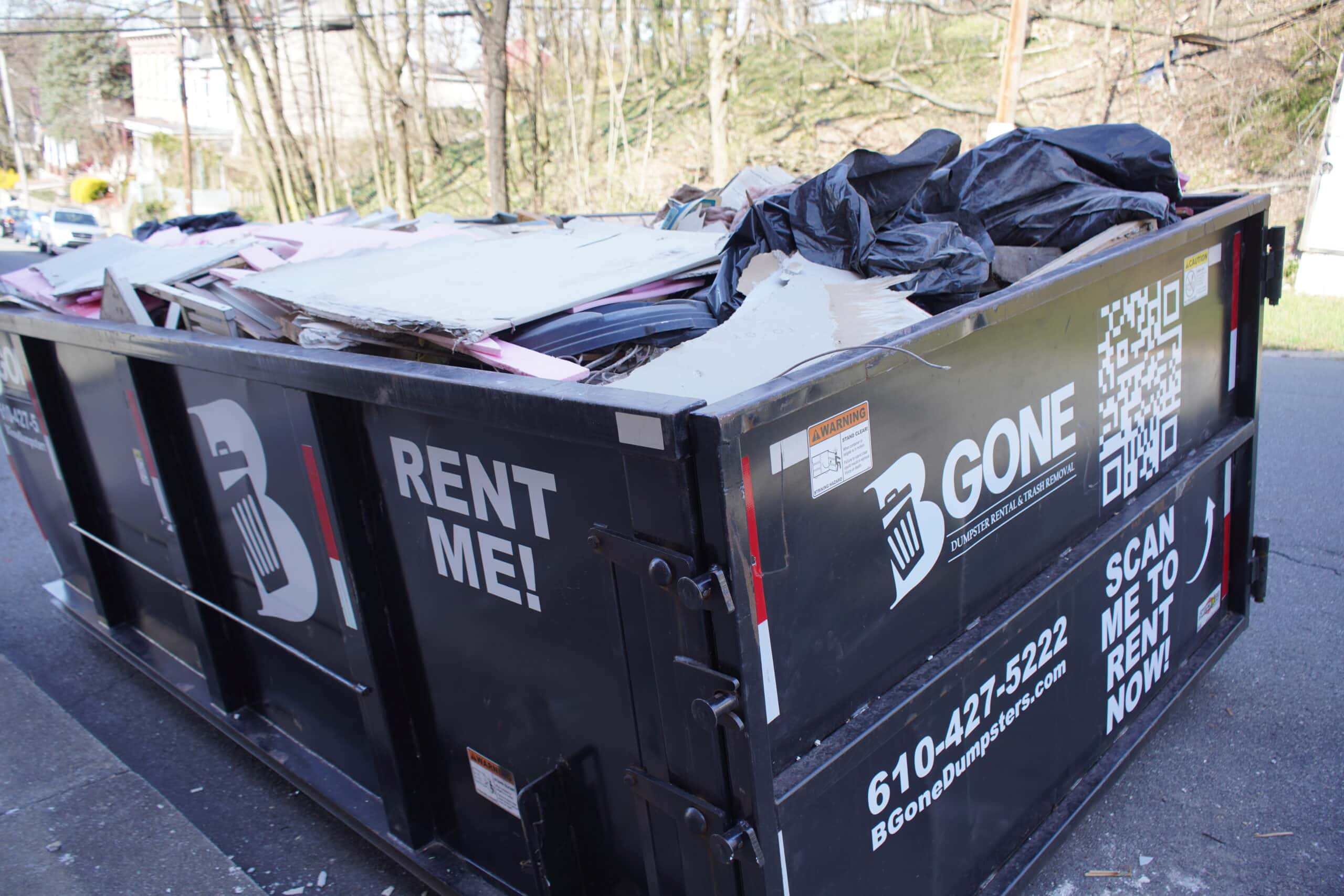 Filled rental dumpster
